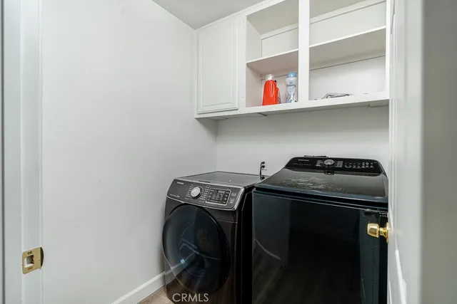 a spacious bedroom with a bed and a window