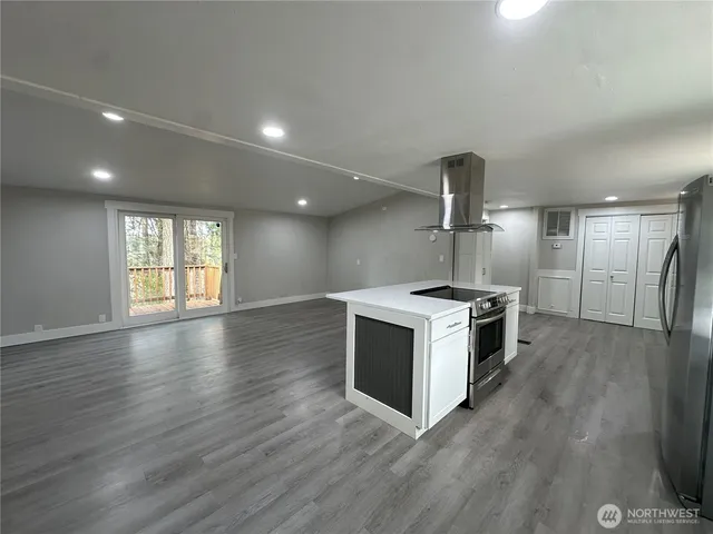 a kitchen with a stove and a sink
