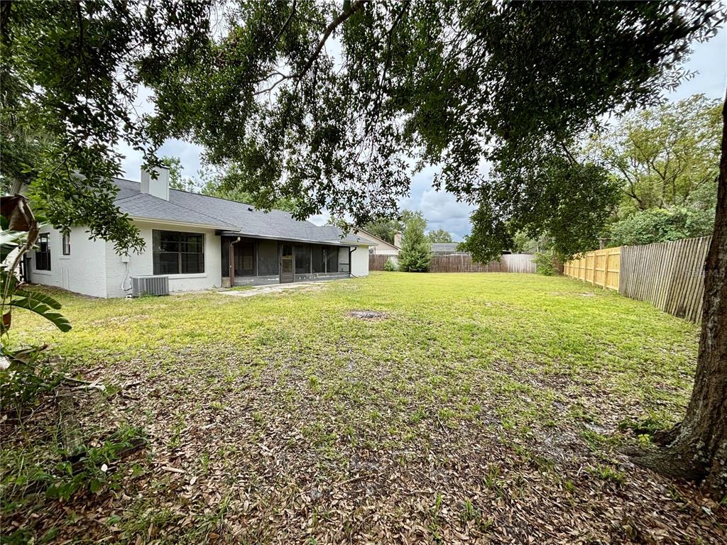 1045 Shaffer Trail Oviedo, FL 32765 - Photo 24 of 30 a view of a house with a yard