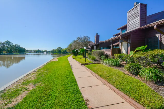 a view of a lake with a building in the background