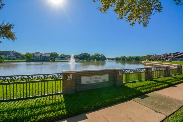 a view of a lake with houses in the back