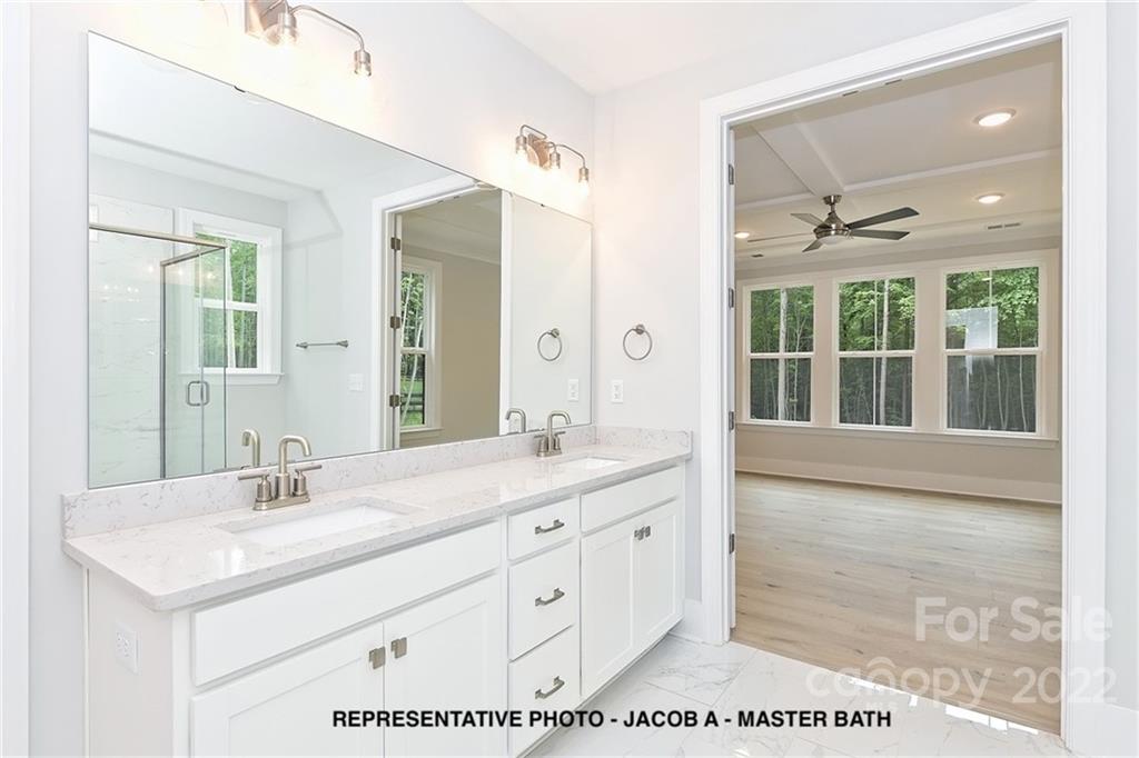 366 Meek Road Gastonia, NC 28056 - Photo 17 of 24 a bathroom with a double vanity sink and a mirror