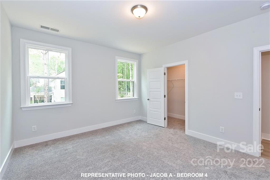 366 Meek Road Gastonia, NC 28056 - Photo 19 of 24 an empty room with windows and closet