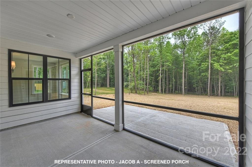 366 Meek Road Gastonia, NC 28056 - Photo 23 of 24 a view of an empty room with wooden floor and a window