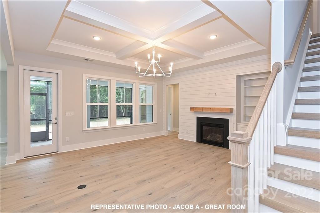 366 Meek Road Gastonia, NC 28056 - Photo 6 of 24 a view of an empty room with wooden floor fireplace and a window