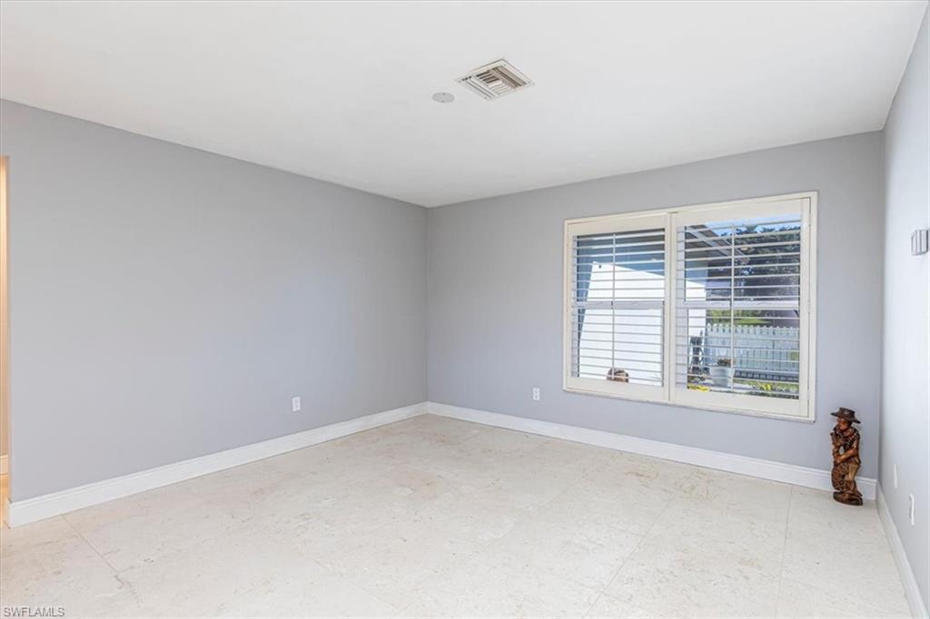 4590 Eagle Key Circle Naples, FL 34112 - Photo 13 of 37 Spacious, separate dining room adaptable for use as an office.