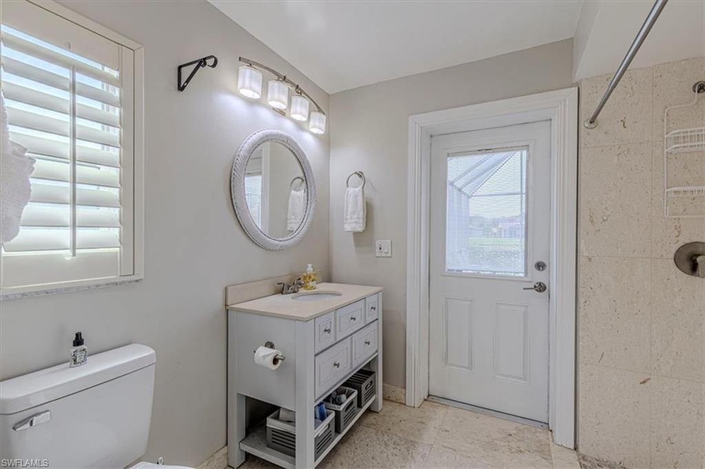 4590 Eagle Key Circle Naples, FL 34112 - Photo 17 of 37 Primary bathroom featuring vanity and a shower