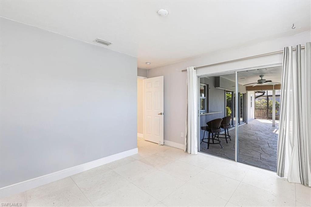 4590 Eagle Key Circle Naples, FL 34112 - Photo 21 of 37 Third bedroom with access to the lanai