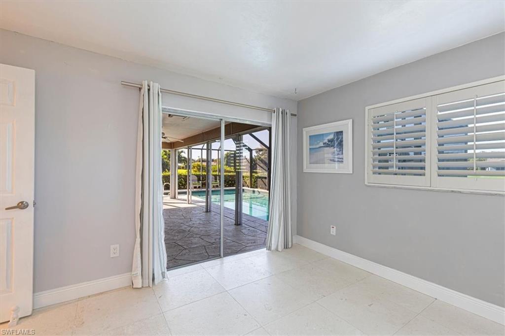 4590 Eagle Key Circle Naples, FL 34112 - Photo 22 of 37 Third bedroom with access to the lanai