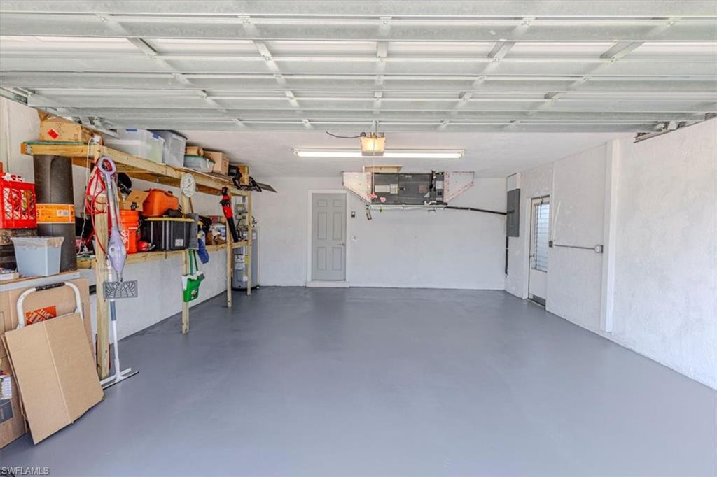 4590 Eagle Key Circle Naples, FL 34112 - Photo 26 of 37 Garage with hurricane rated/braced door