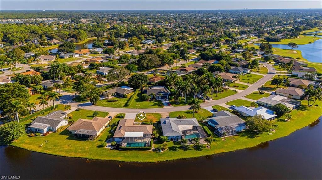 4590 Eagle Key Circle Naples, FL 34112 - Photo 33 of 37 Aerial perspective of suburban area featuring a nearby body of water