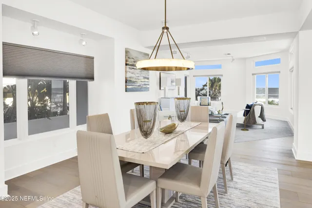 a kitchen with stainless steel appliances a stove a sink a microwave a refrigerator and cabinets