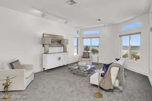 a bedroom with bed and a large window