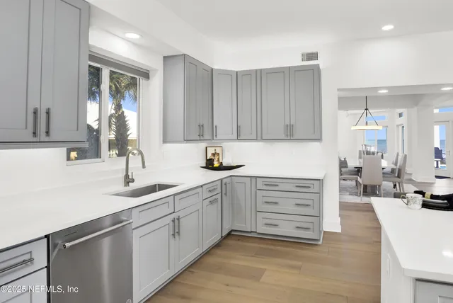 a view of an entryway with wooden floor