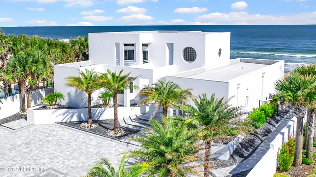 a living room with furniture and a hard wood floor