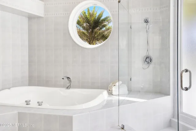 a view of a house with swimming pool and sitting area