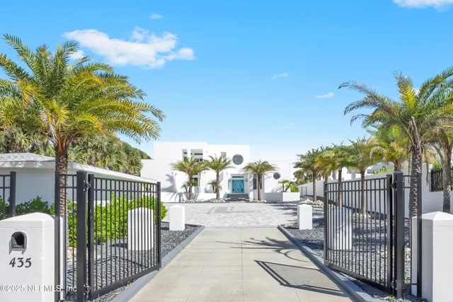 an empty room with a window and a ceiling fan