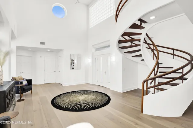 a view of living room with furniture and a dining table