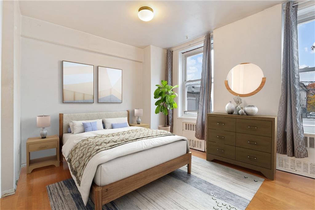 1625 Emmons Avenue, Unit 1S Brooklyn, NY 11235 - Photo 8 of 12 a bedroom with a bed and a dresser