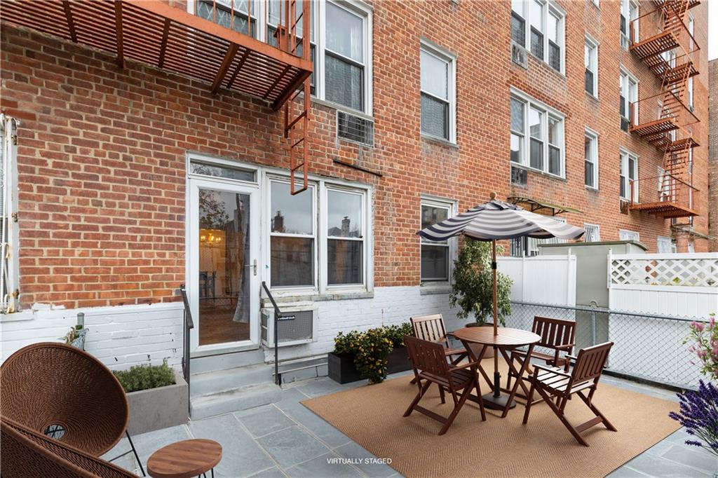 1625 Emmons Avenue, Unit 1S Brooklyn, NY 11235 - Photo 10 of 12 a view of a building with outdoor seating