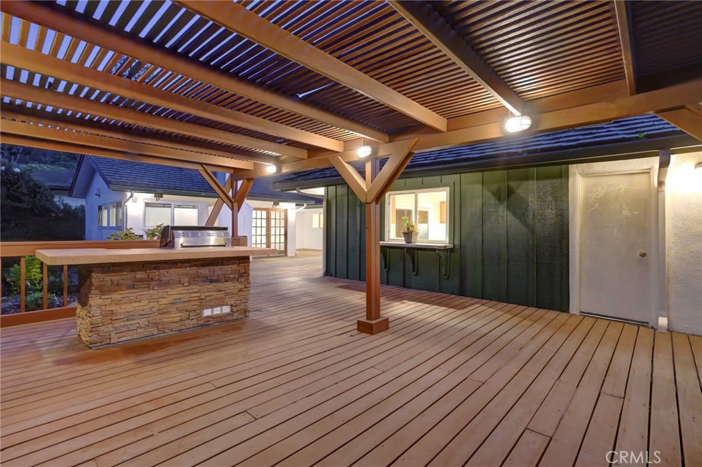 5205 Middlecrest Road Rancho Palos Verdes, CA 90275 - Photo 10 of 36 a view of an empty room with wooden floor and a window