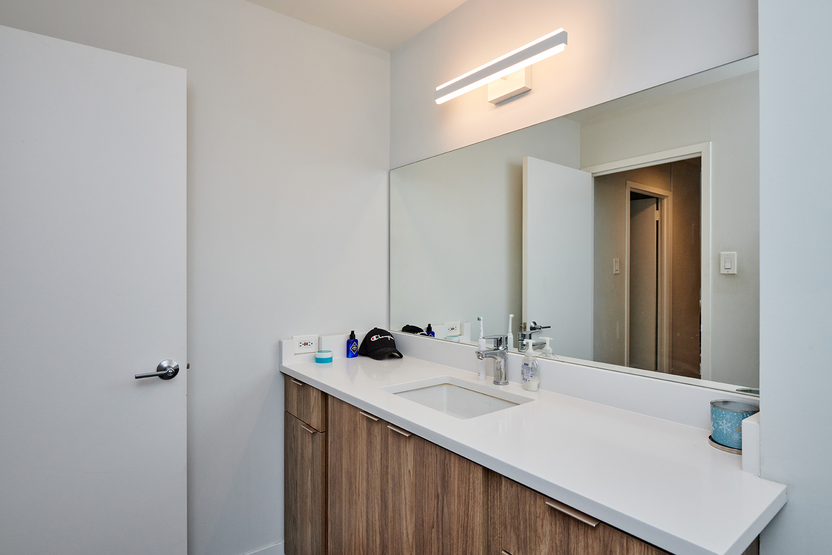 211 East Ohio Street, Unit 614 Chicago, IL 60611 - Photo 12 of 21 a bathroom with a sink and a mirror