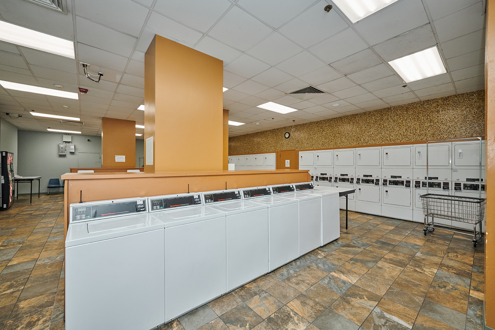 211 East Ohio Street, Unit 614 Chicago, IL 60611 - Photo 14 of 21 a large kitchen with a lot of counter space and a sink