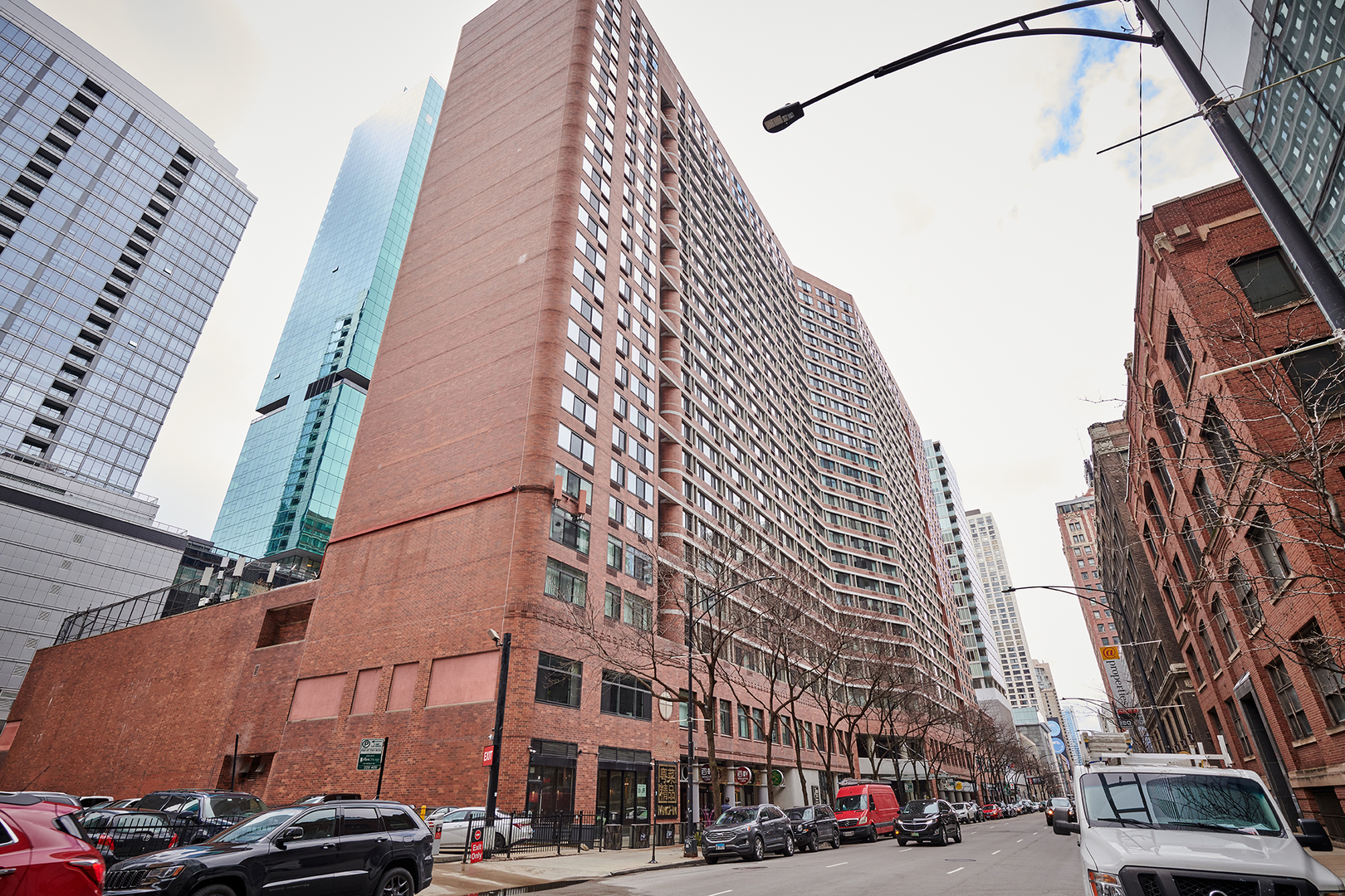 211 East Ohio Street, Unit 614 Chicago, IL 60611 - Photo 21 of 21 a city street lined with buildings and cars
