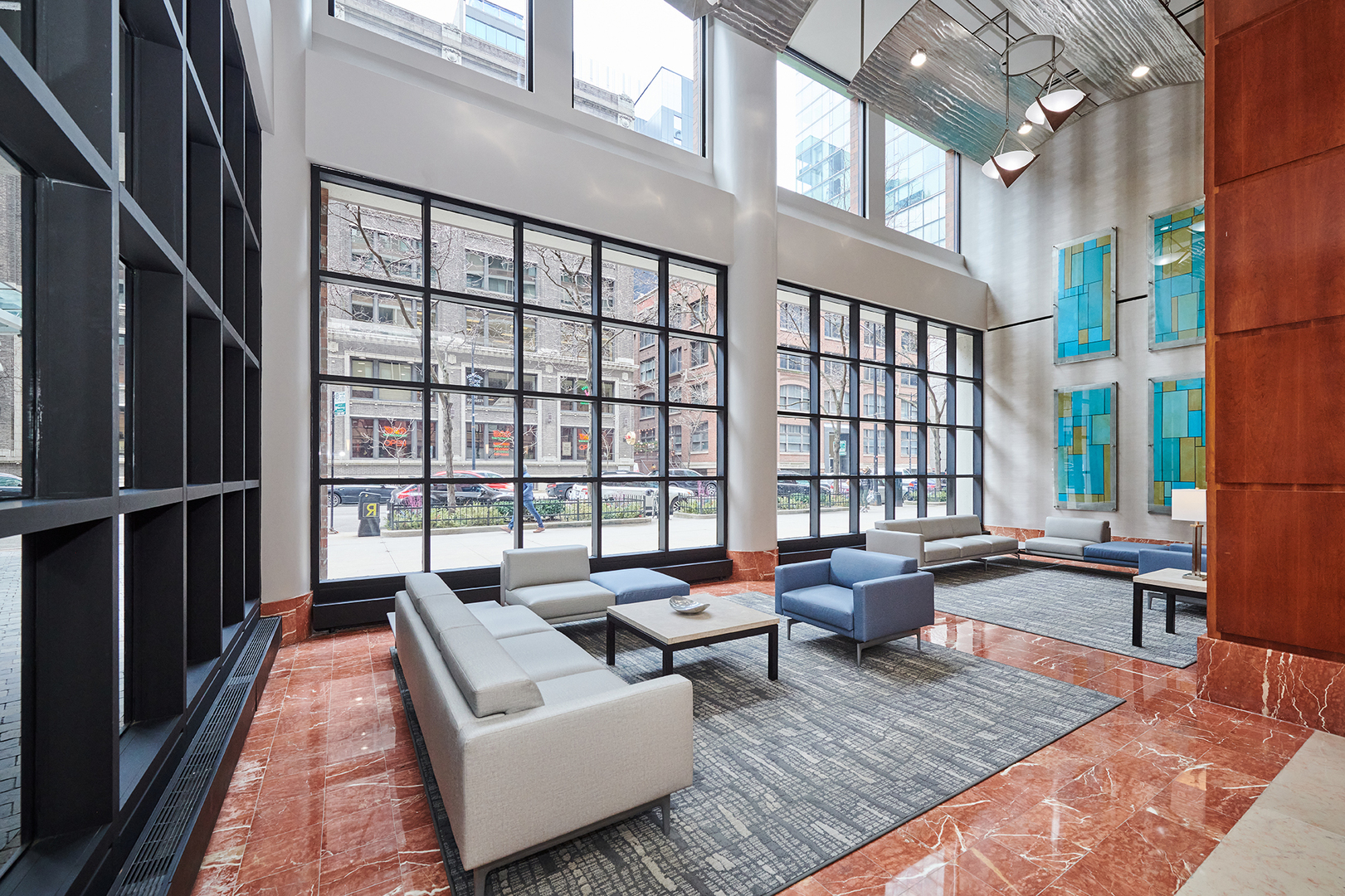 211 East Ohio Street, Unit 614 Chicago, IL 60611 - Photo 3 of 21 a living room with furniture floor to ceiling window and wooden floor