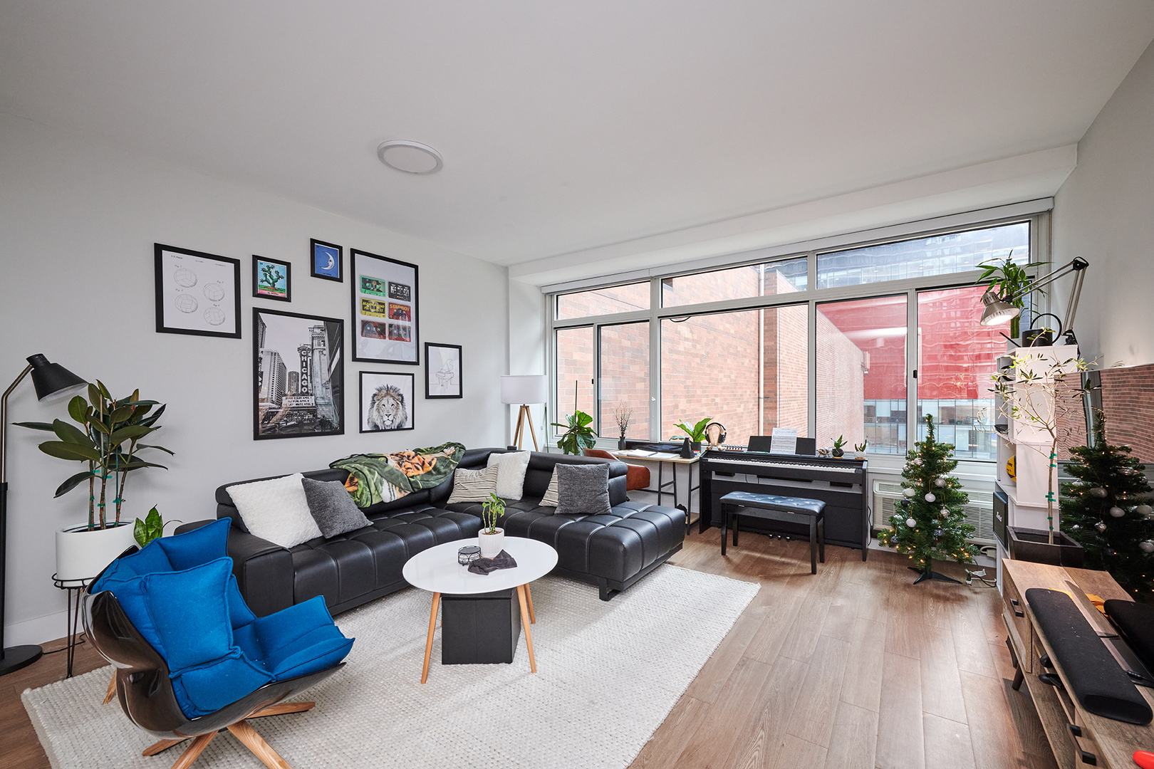 211 East Ohio Street, Unit 614 Chicago, IL 60611 - Photo 5 of 21 a living room with furniture and a large window