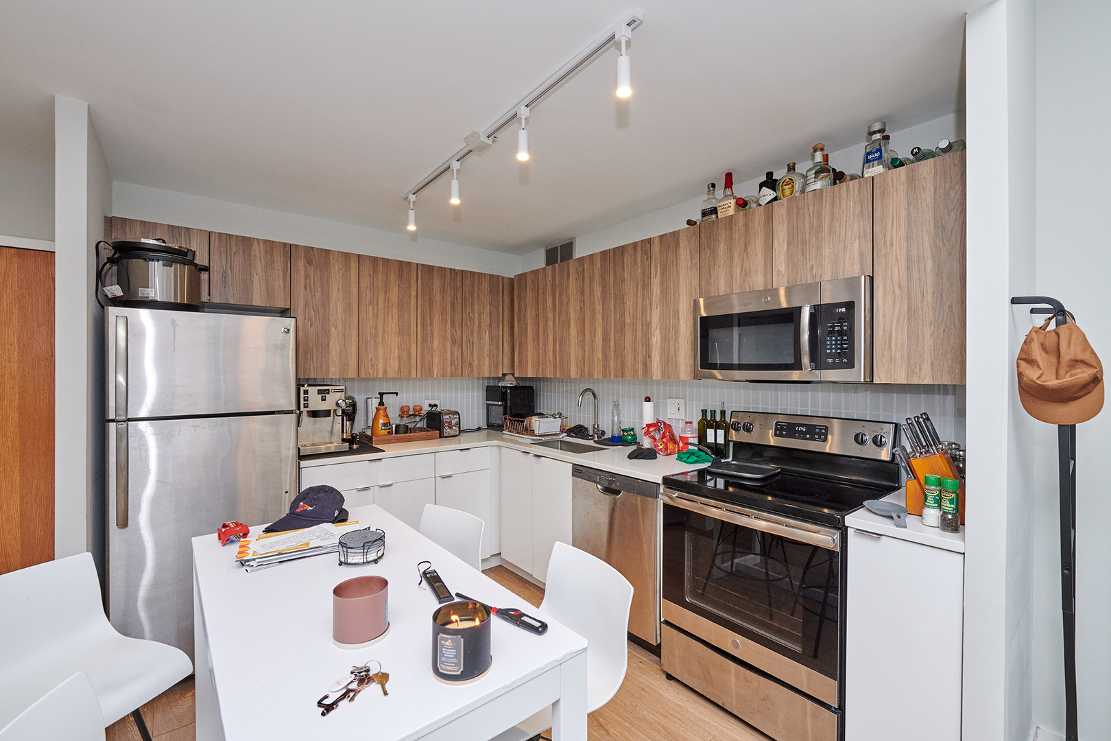 211 East Ohio Street, Unit 614 Chicago, IL 60611 - Photo 7 of 21 a kitchen with a sink a stove and refrigerator