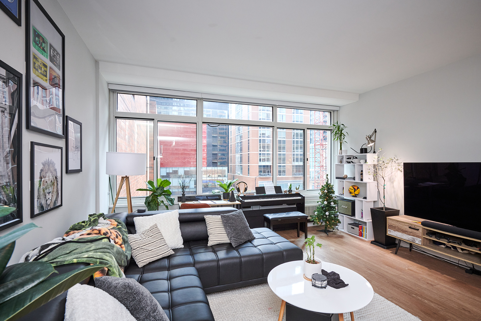 211 East Ohio Street, Unit 614 Chicago, IL 60611 - Photo 8 of 21 a living room with furniture and a flat screen tv
