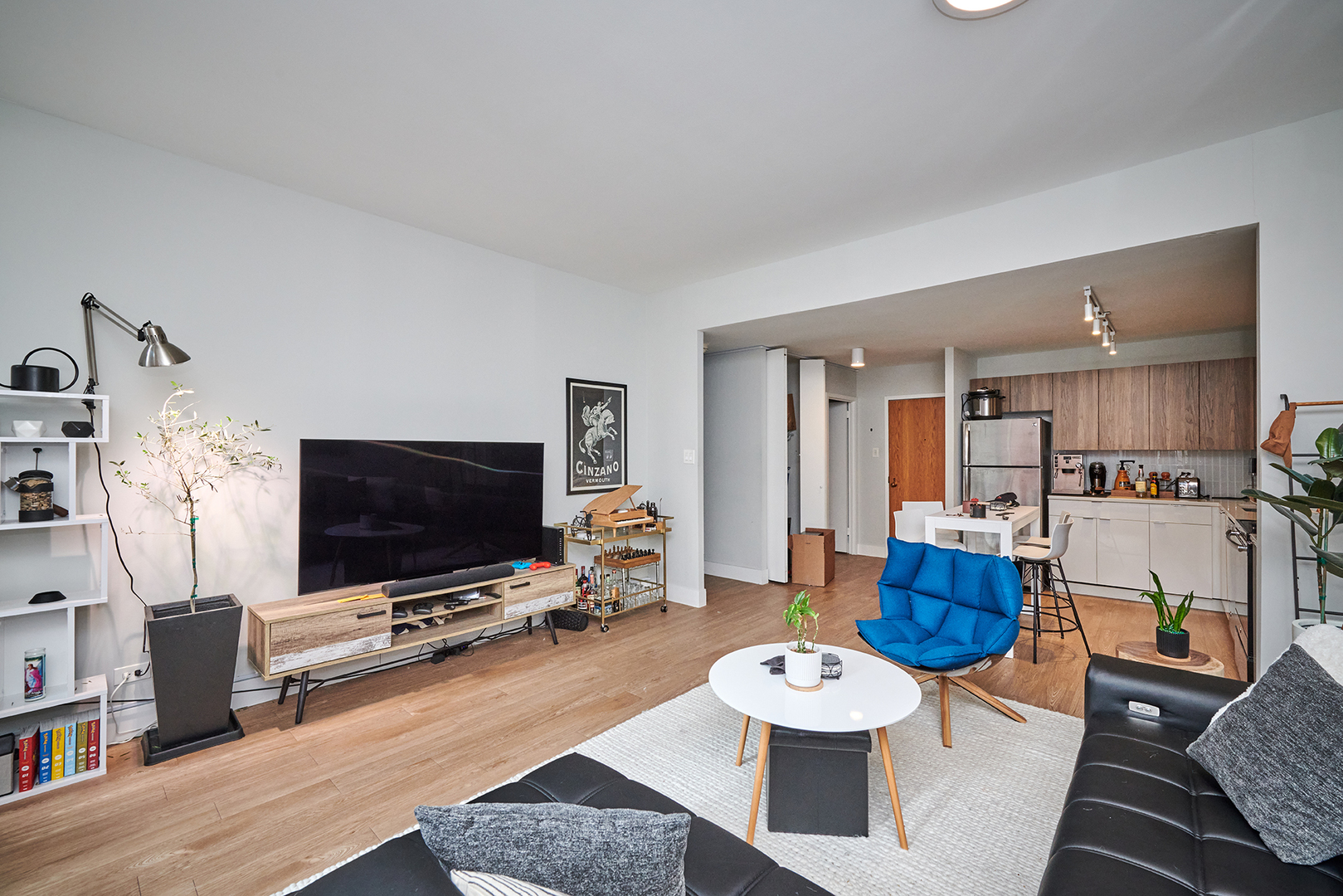 211 East Ohio Street, Unit 614 Chicago, IL 60611 - Photo 9 of 21 a living room with furniture and a flat screen tv