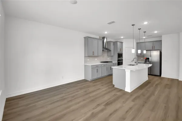 a view of kitchen with wooden floor