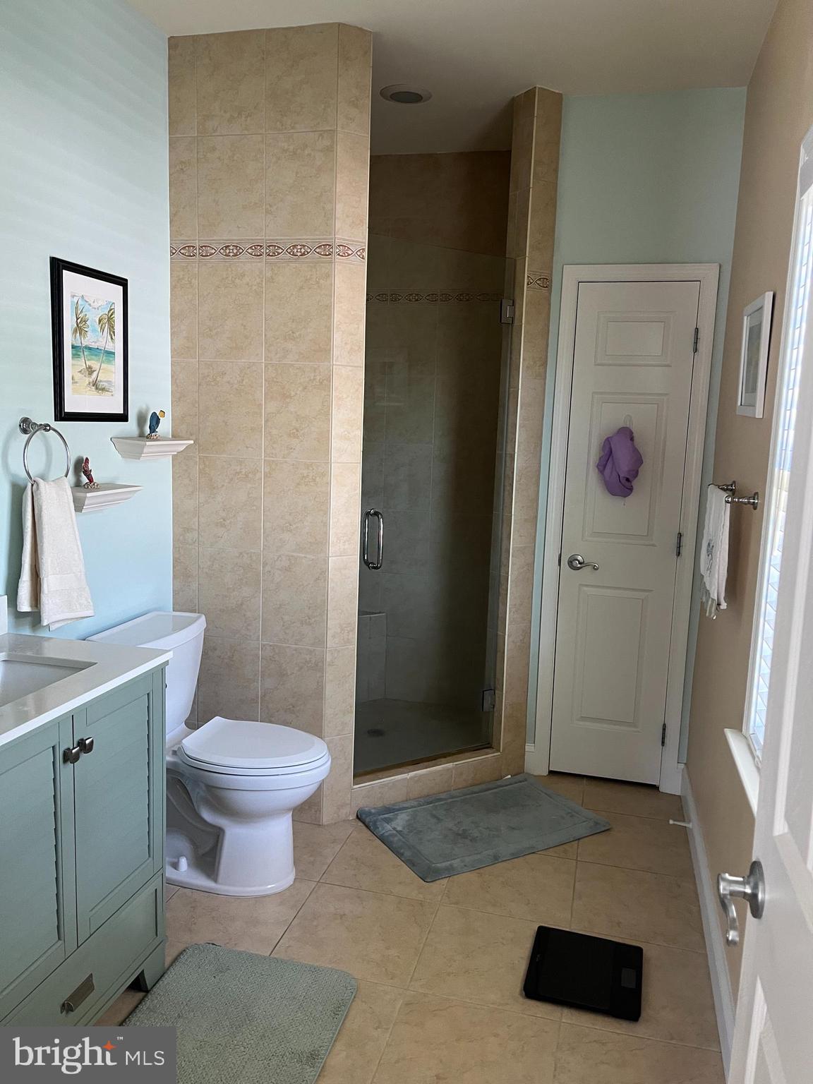 3816 Chestnut Road Baltimore, MD 21220 - Photo 19 of 27 a bathroom with a toilet a sink and shower