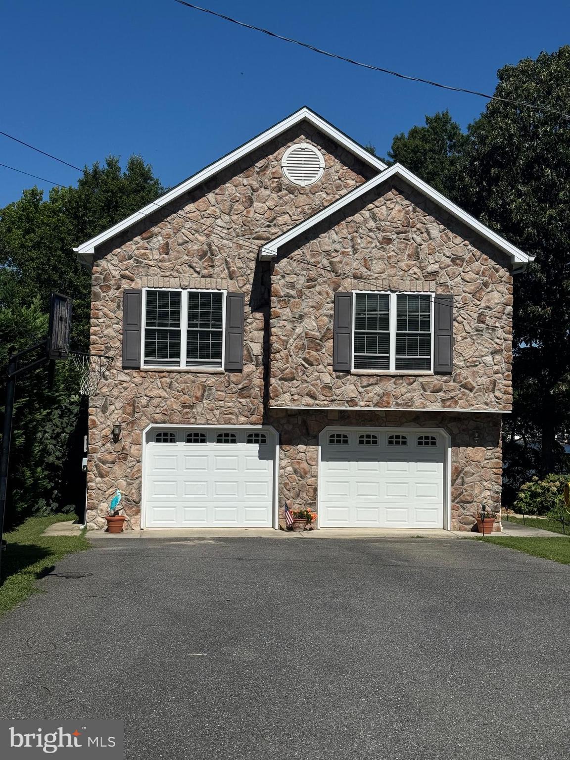 3816 Chestnut Road Baltimore, MD 21220 - Photo 2 of 27 a front view of a house with a yard and garage