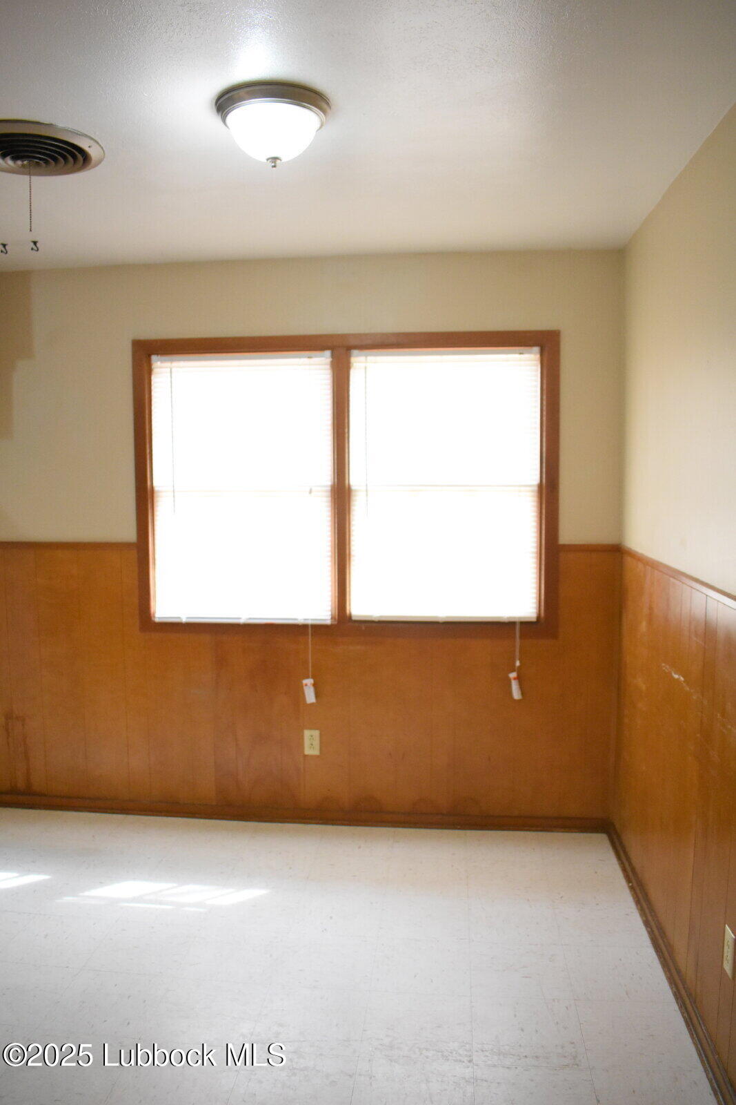 2010 54th Street Lubbock, TX 79412 - Photo 6 of 17 an empty room with a window