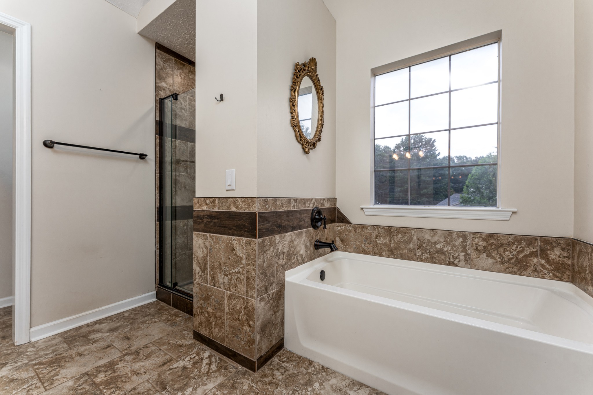 809 Ridgetop Drive Mount Juliet, TN 37122 - Photo 17 of 32 a bathroom with a tub and a window