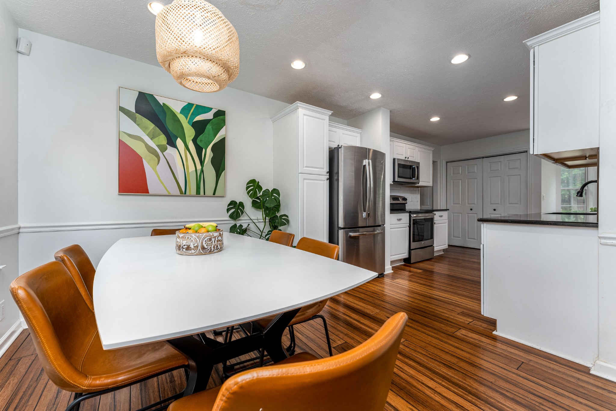 809 Ridgetop Drive Mount Juliet, TN 37122 - Photo 6 of 32 a kitchen with stainless steel appliances granite countertop a dining table chairs and refrigerator