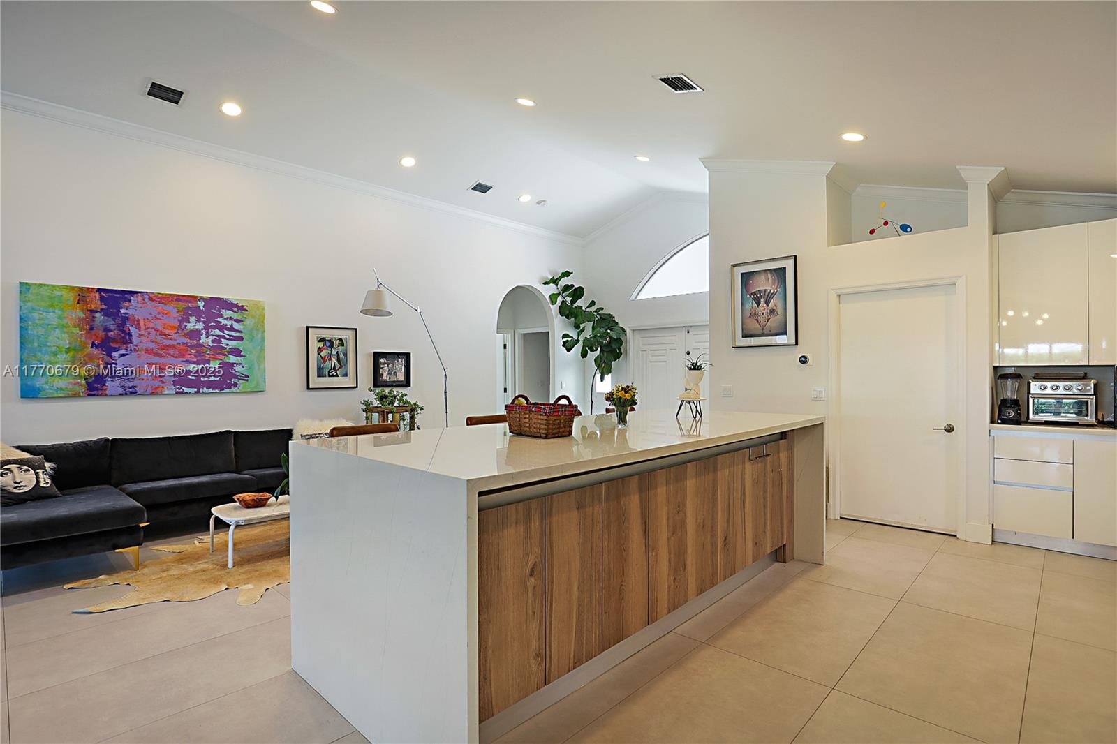 8919 Byron Avenue Surfside, FL 33154 - Photo 15 of 51 a kitchen with sink cabinets and counter space