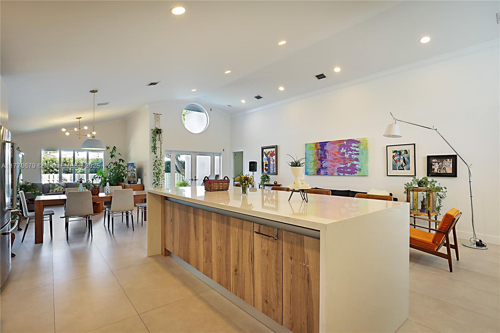 8919 Byron Avenue Surfside, FL 33154 - Photo 17 of 51 a view of a kitchen and dining room