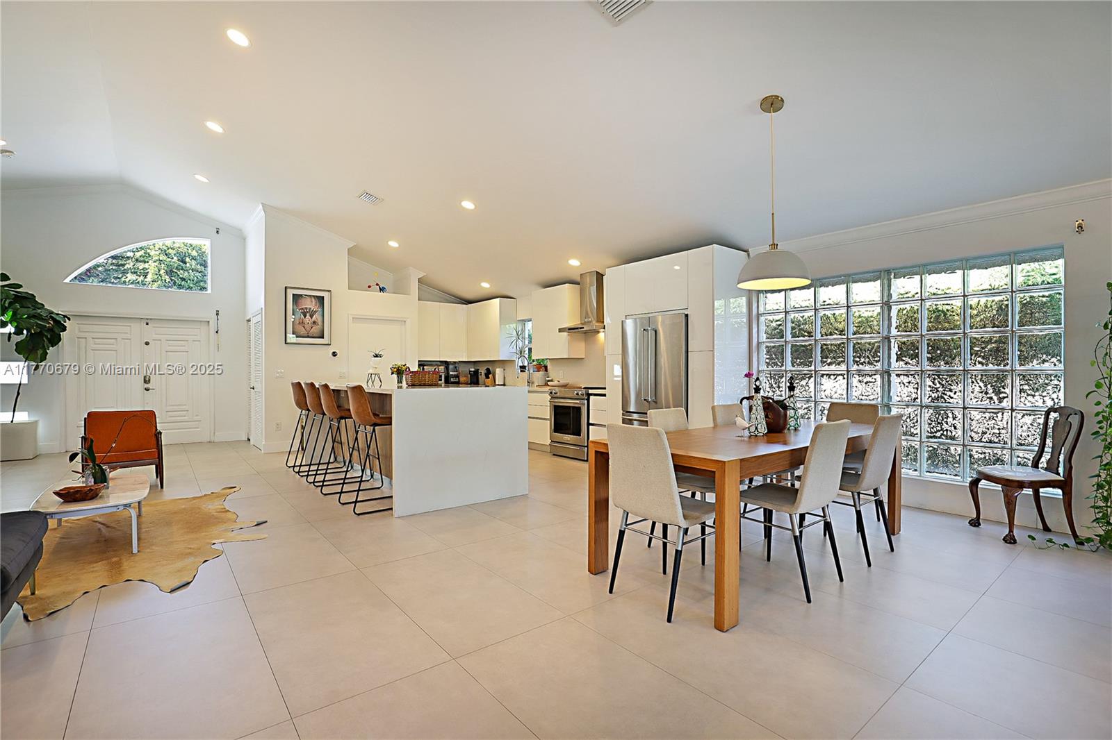 8919 Byron Avenue Surfside, FL 33154 - Photo 18 of 51 a dining room with furniture and wooden floor
