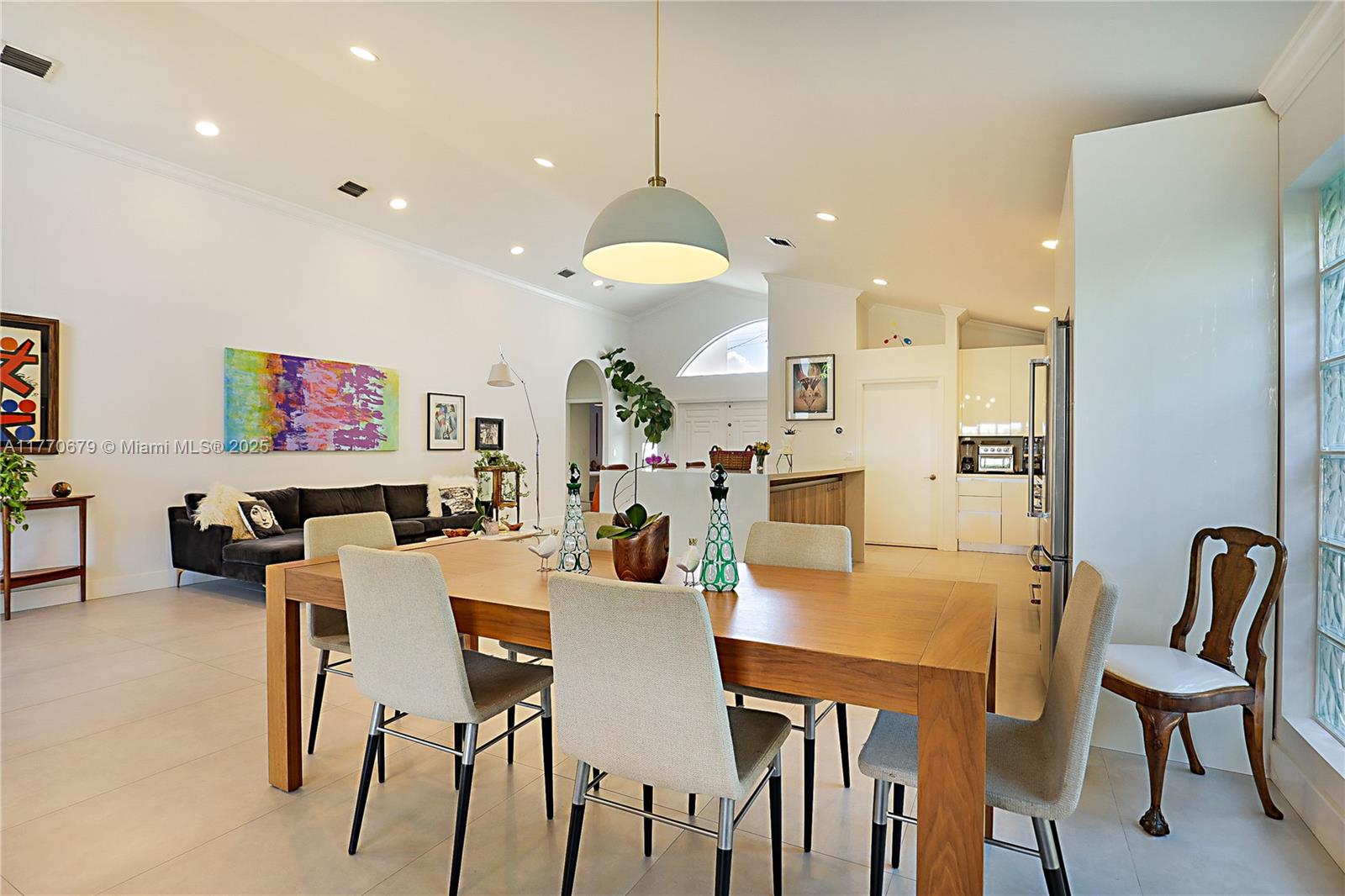 8919 Byron Avenue Surfside, FL 33154 - Photo 21 of 51 a view of a dining room with furniture