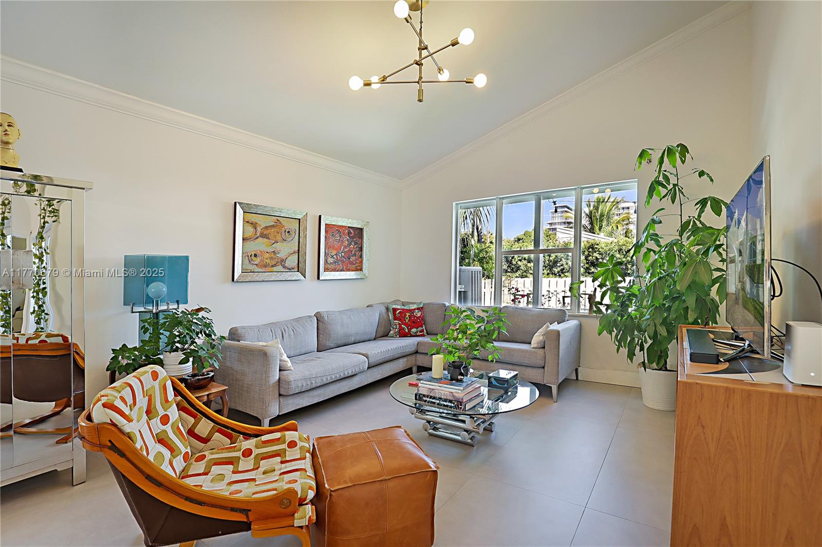 8919 Byron Avenue Surfside, FL 33154 - Photo 23 of 51 a living room with furniture potted plant and a window