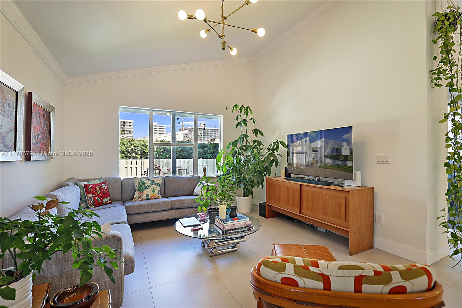 8919 Byron Avenue Surfside, FL 33154 - Photo 24 of 51 a living room with furniture and a potted plant