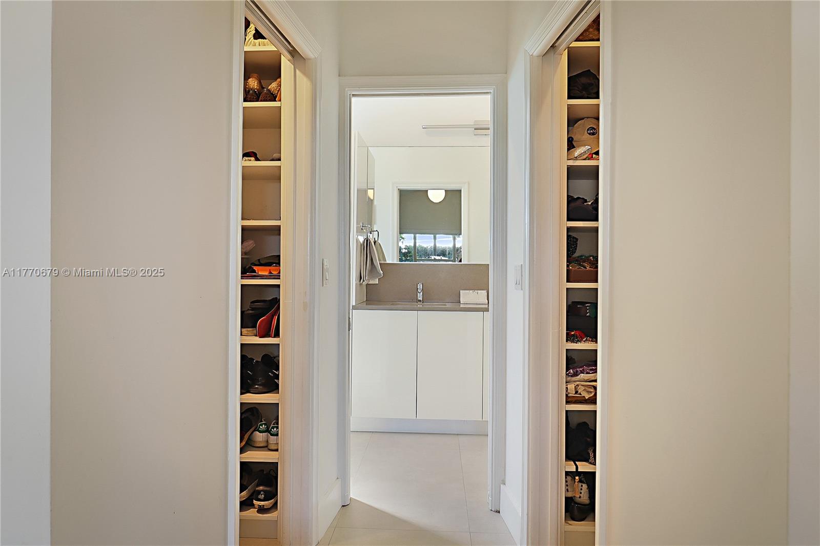 8919 Byron Avenue Surfside, FL 33154 - Photo 28 of 51 hallway with front door