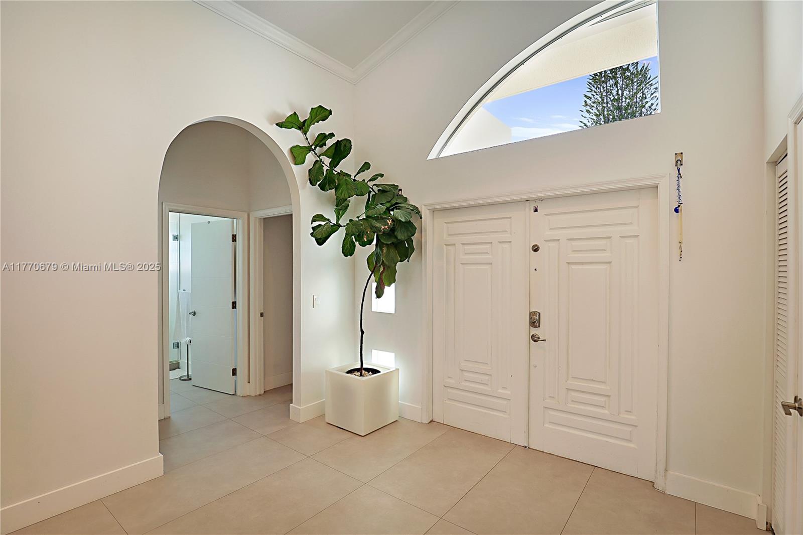 8919 Byron Avenue Surfside, FL 33154 - Photo 31 of 51 a view of an entryway with wooden floor