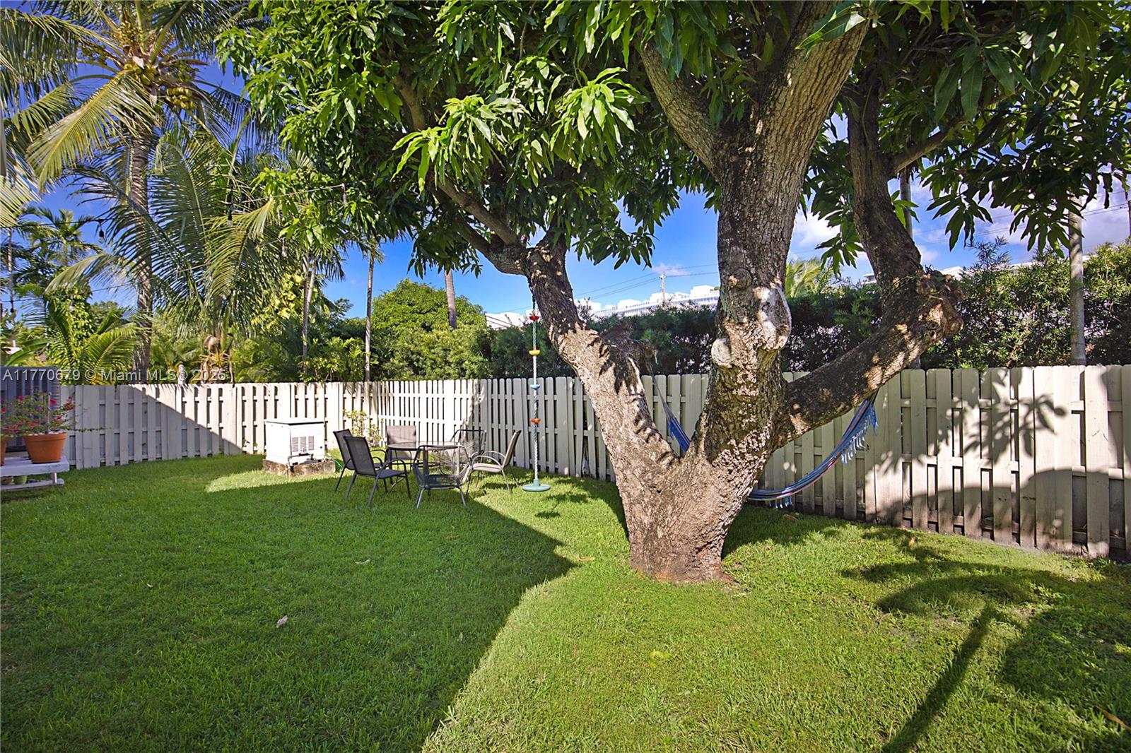 8919 Byron Avenue Surfside, FL 33154 - Photo 38 of 51 a view of a bench in a park