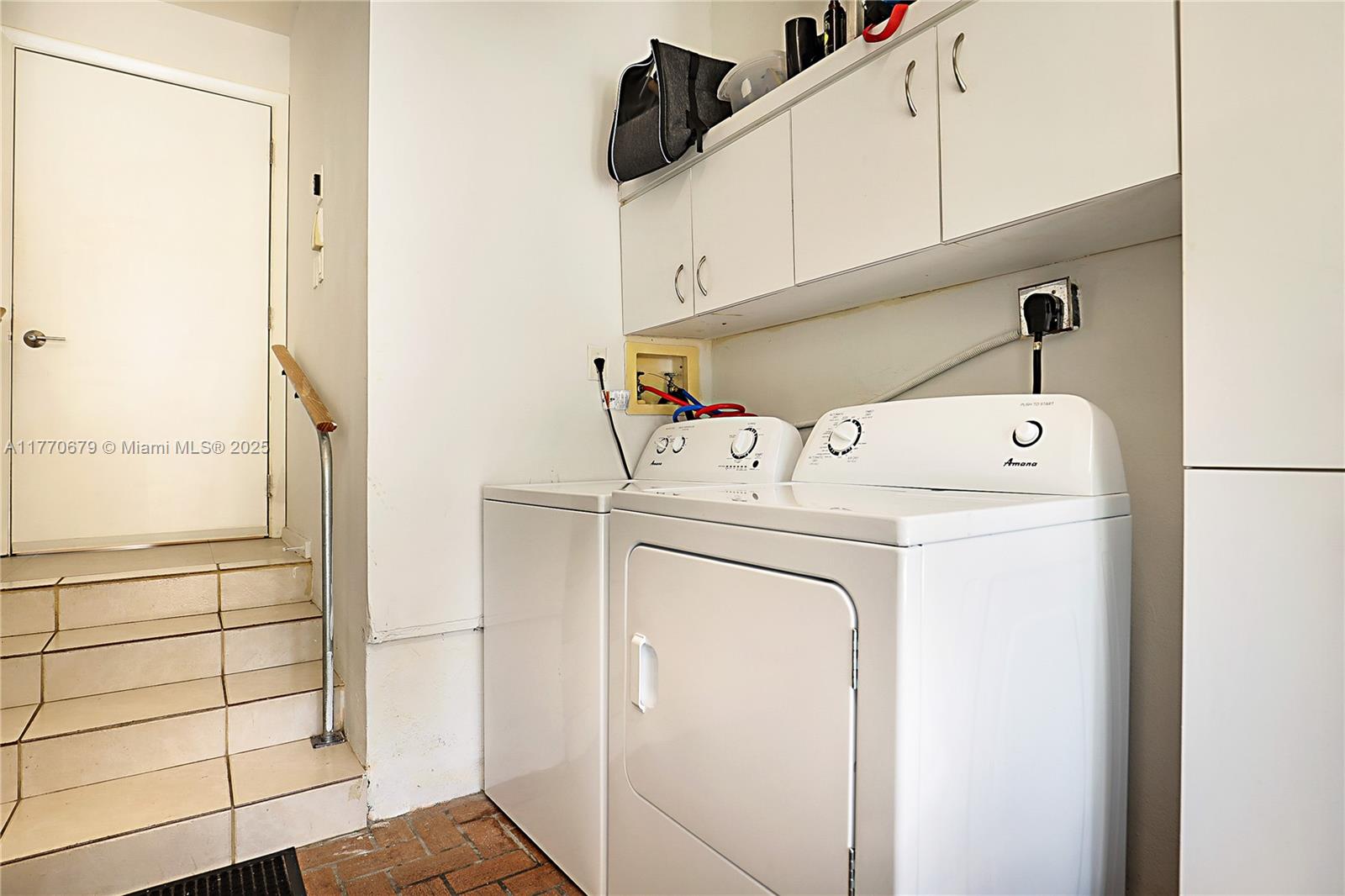 8919 Byron Avenue Surfside, FL 33154 - Photo 42 of 51 a utility room with dryer and washer