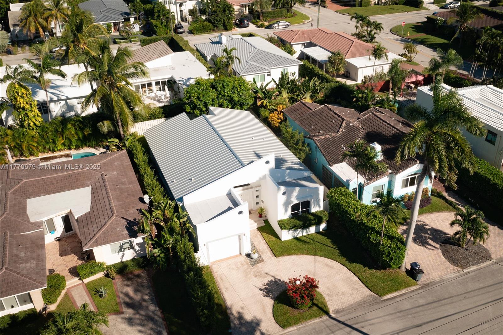 8919 Byron Avenue Surfside, FL 33154 - Photo 46 of 51 an aerial view of multiple houses with yard